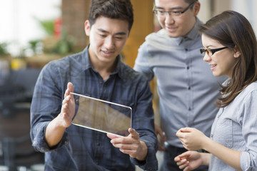 IT workers developing digital tablet