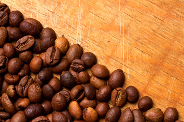 Coffee beans on wood background