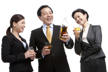 Business team enjoying whiskey