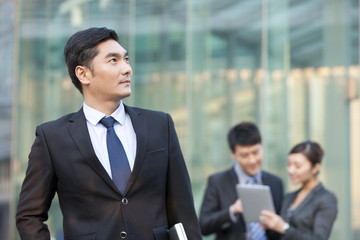 Business people outside office building