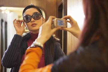 Woman Being Photographed By Her Friend