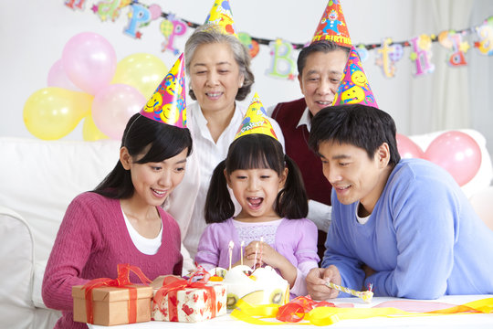 Young Chinese girl's birthday with family