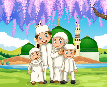 Muslim family standing in the park