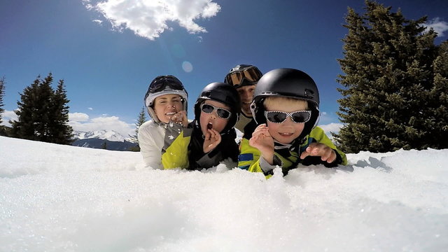 portrait winter ski skiing vacation Caucasian family parents boys snow resort