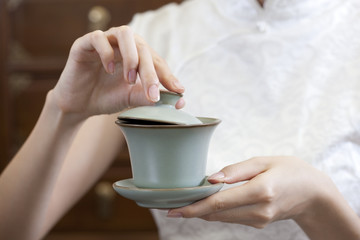 Young woman with a cup of Chinese tea