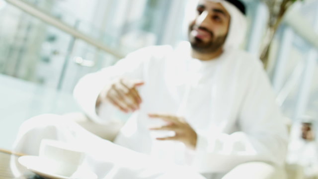 male Emirati kandura hotel relaxation travel tourism lifestyle handshake