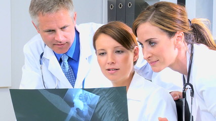 Western European male female doctor medical executive x-ray computer technology - Powered by Adobe