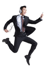 Businessman Listening to Music © Blue Jean Images