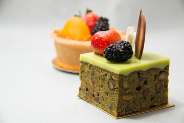  pittachio cake on top  tropical fruits