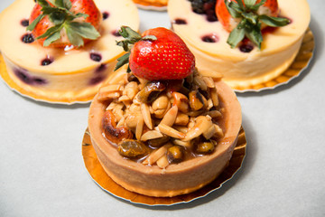 almond nut tart on top fresh strawberry and blueberry cheese