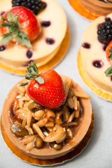 almond nut tart on top fresh strawberry and blueberry cheese