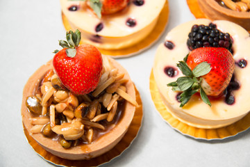 almond nut tart on top fresh strawberry and blueberry cheese