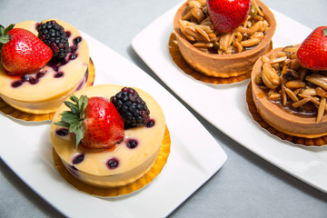 almond nut tart on top fresh strawberry and blueberry cheese