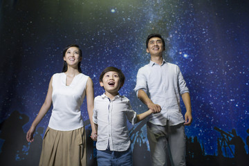 Young family in science and technology museum