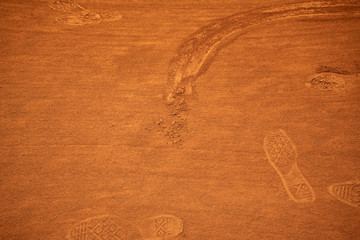 red sand with mark and footprints