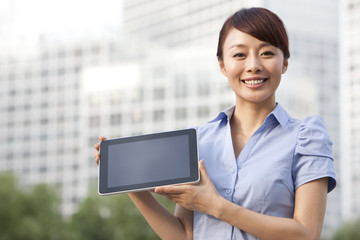 Businesswoman Showing a Tablet