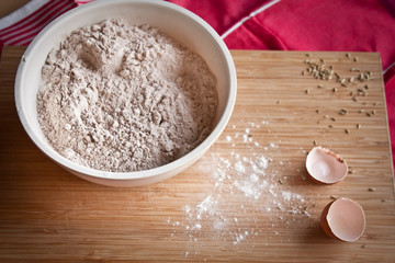 Flour in a large bowl on a cutting board