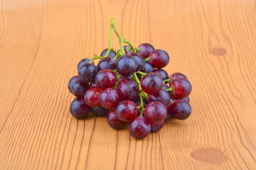 Fresh grape on wooden table.