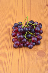 Fresh grape on wooden table.