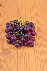 Fresh grape on wooden table.