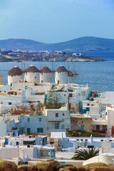 four famous windmills overlooking Little Venice and Mykonos old