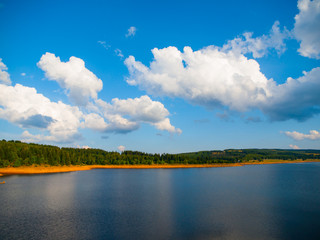 Summer landscape with forests and lake