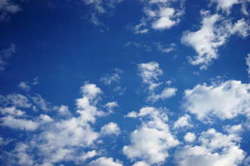 white fluffy clouds in the blue sky