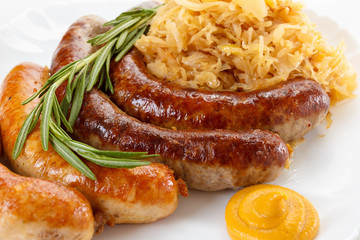 Traditional Oktoberfest menu, plate of sausages and sauerkraut