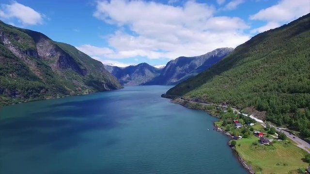 Beautiful fjord Aurlandsfjorden in Norway with tall mountains surrounding the water. Aerial 4k Ultra HD.