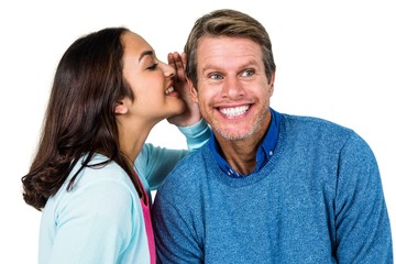 Fototapeta premium Woman sharing secret with man