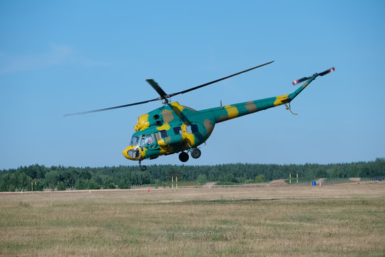 rescue helicopter in camouflage landing
