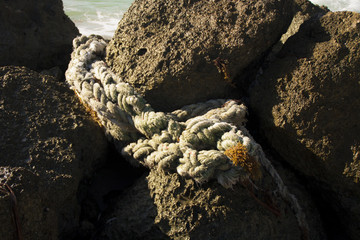 Sea stone and old rope