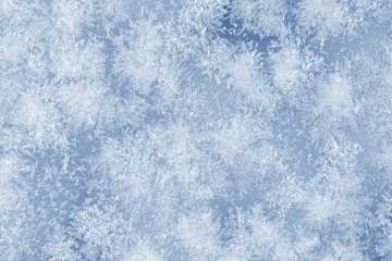 Ice crystals on a glass window during winter