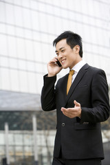 Businessmen talking on cellphone