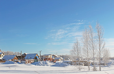 The village in a sunny day in cold winter