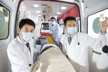 Fototapeta na wymiar Medics moving a patient from an ambulance