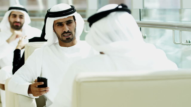 Emirati male business meeting oil financial smart phone technology