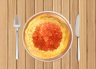 Delicious pancakes with red caviar on white plate on wooden tabl