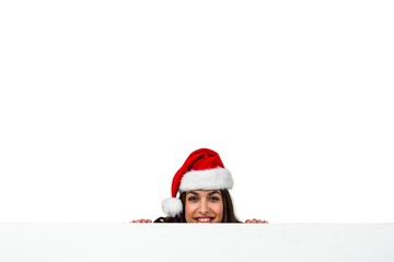 Portrait of woman wearing red Santa hat