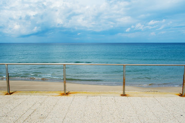 metal railing by the shore in Sardinia