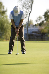 Golfer putting on the Green
