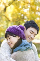 Young Couple Enjoying a Park in Autumn