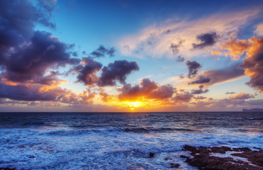 pink sunset over Alghero shoreline