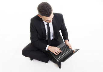 portrait of young businessman with laptop isolated on white back