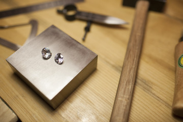 Diamonds on jeweler's workbench