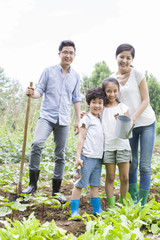 Young family gardening together