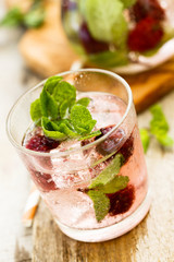 Cocktail with blackberry and fresh mint