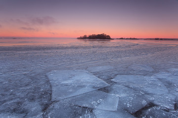 Winter dawn on the ocean. Ice covered ocean.