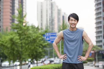 Young man doing exercise outside