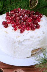 Holiday layered cake with cream and cranberry decoration